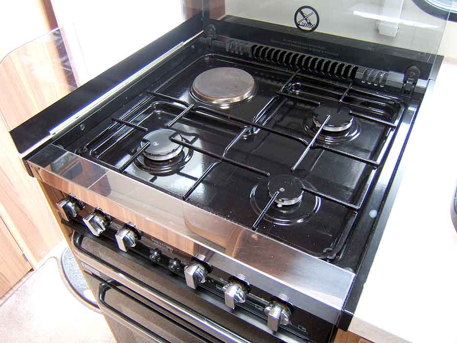 The hob unit with 3 gas burners and 1 electric hotplate.